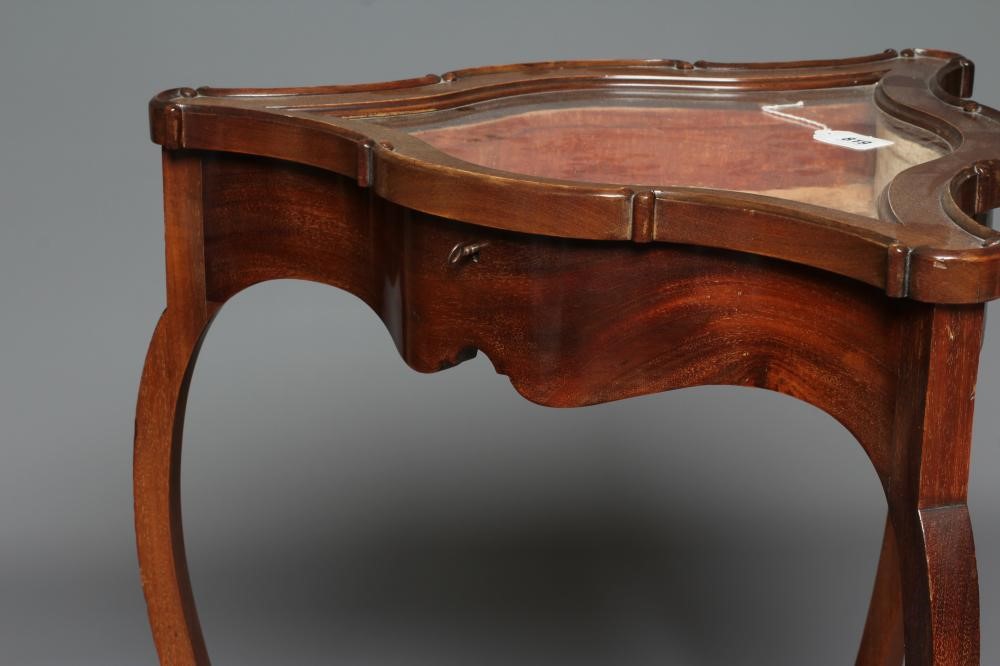 A MAHOGANY BIJOUTERIE TABLE Image