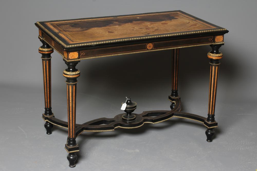 A VICTORIAN EBONISED AND AMBOYNA LIBRARY TABLE Image