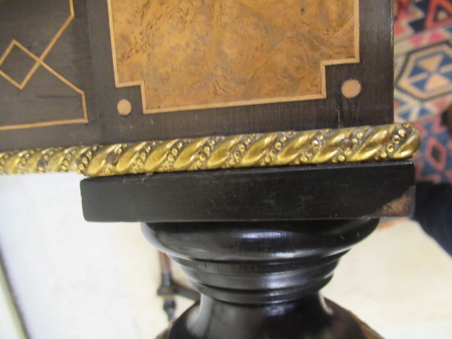 A VICTORIAN EBONISED AND AMBOYNA LIBRARY TABLE Image
