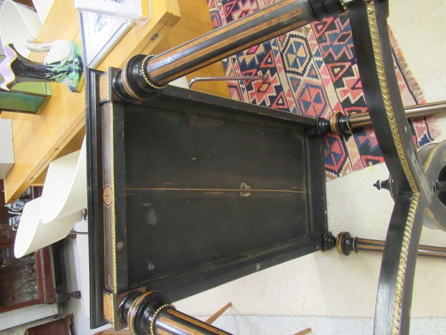 A VICTORIAN EBONISED AND AMBOYNA LIBRARY TABLE Image