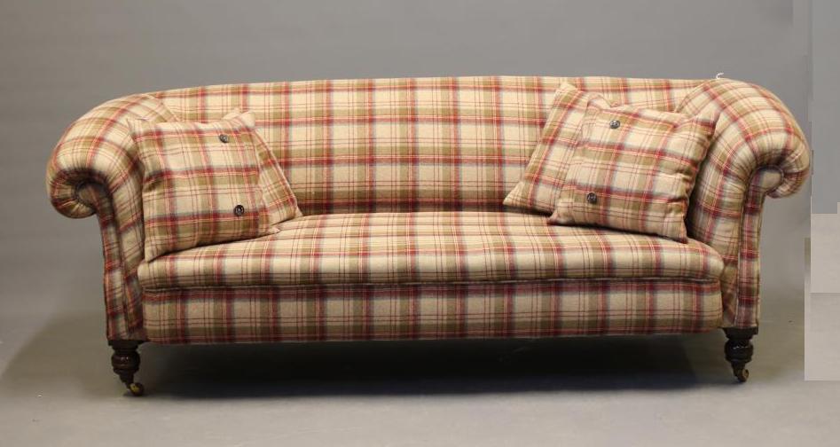 A VICTORIAN WALNUT FRAMED CHESTERFIELD SOFA, upholstered in wool tartan, raised on turned legs with Image