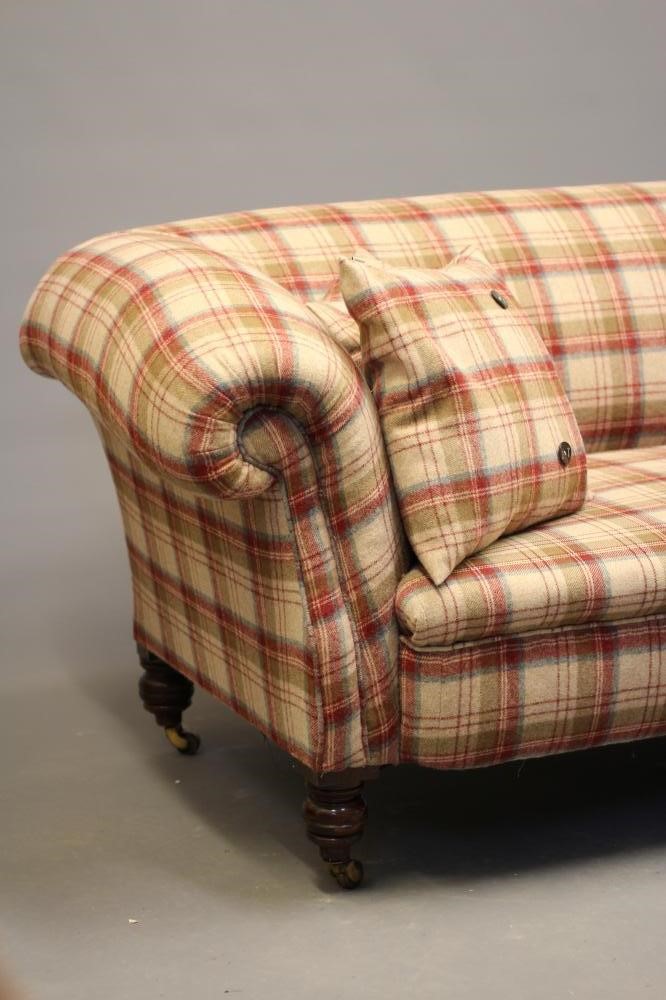 A VICTORIAN WALNUT FRAMED CHESTERFIELD SOFA, upholstered in wool tartan, raised on turned legs with Image