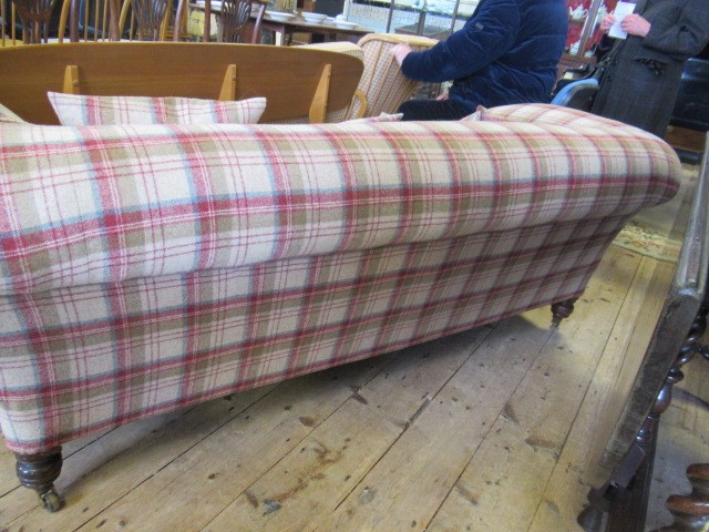 A VICTORIAN WALNUT FRAMED CHESTERFIELD SOFA, upholstered in wool tartan, raised on turned legs with Image