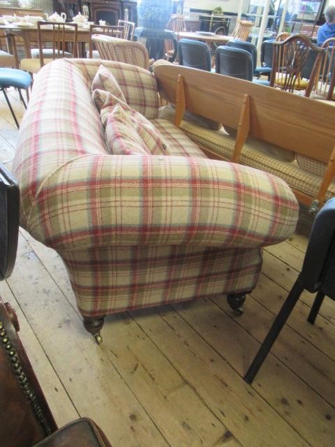 A VICTORIAN WALNUT FRAMED CHESTERFIELD SOFA, upholstered in wool tartan, raised on turned legs with Image