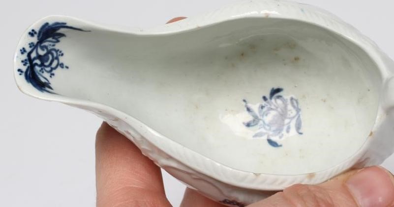 A CHRISTIANS PORCELAIN SAUCE BOAT, 1768-78, smaller but similar to the previous lot and painted with Image