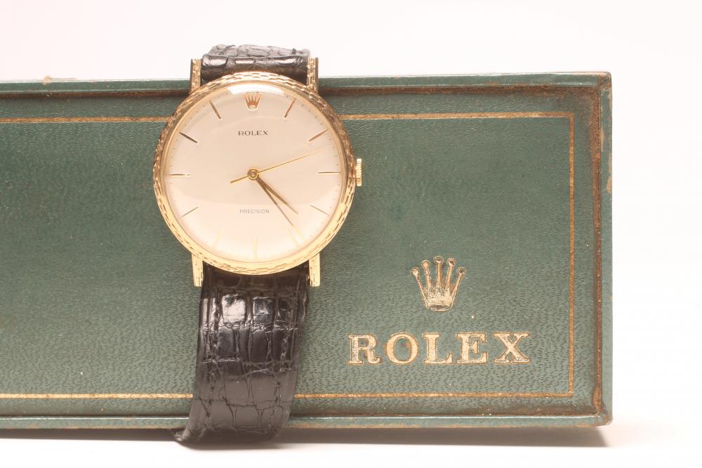 A GENTLEMAN'S GOLD ROLEX DRESS WATCH Image