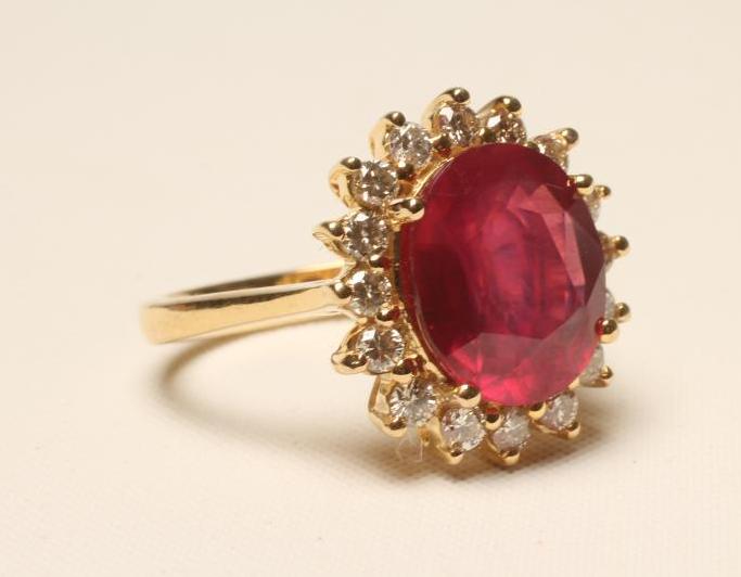A RUBY AND DIAMOND CLUSTER RING Image