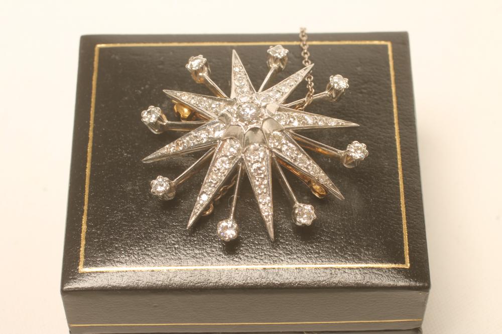 A DIAMOND STAR BROOCH Image