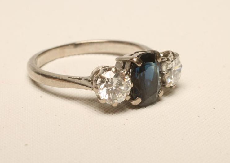 A SAPPHIRE AND DIAMOND THREE STONE RING Image