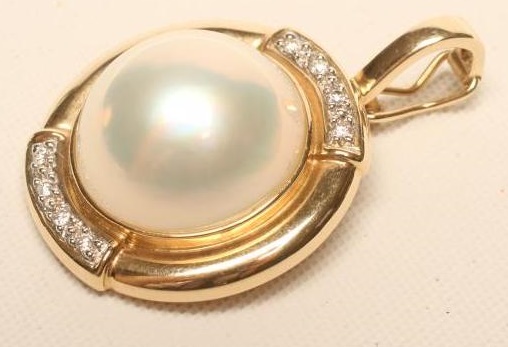 A MABE PEARL AND DIAMOND PENDANT Image