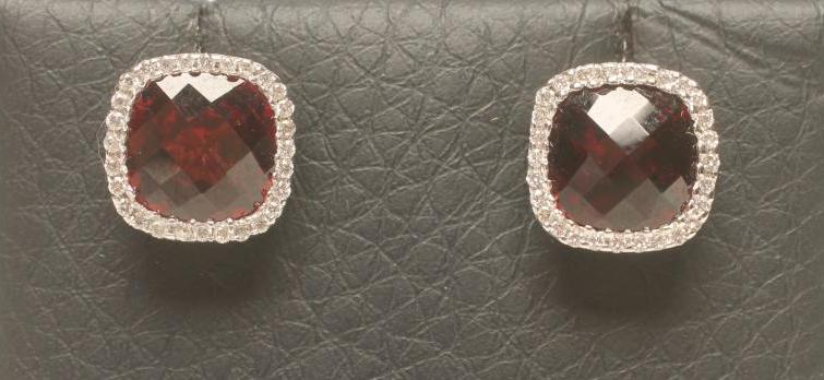 A PAIR OF GARNETT AND DIAMOND CLUSTER EAR STUDS Image