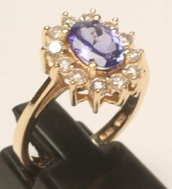 A TANZANITE AND DIAMOND CLUSTER RING Image