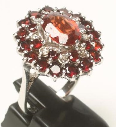 A GARNET AND DIAMOND COCKTAIL RING Image