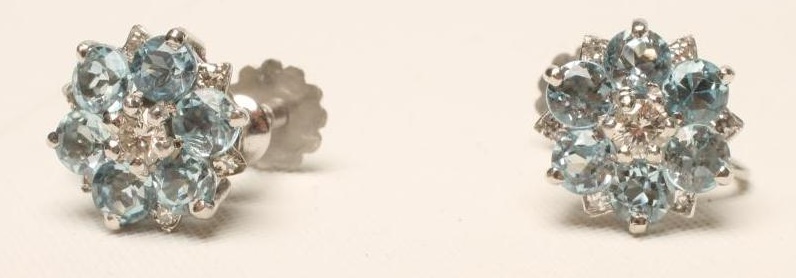 A PAIR OF AQUAMARINE AND DIAMOND CLUSTER EARRINGS centred by a round brilliant cut diamond to a Image
