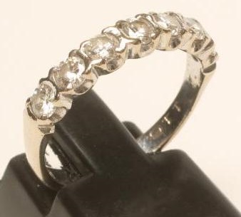 A SEVEN STONE DIAMOND HALF HOOP ETERNITY RING Image