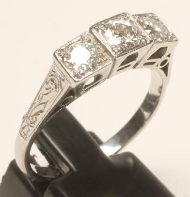 A THREE STONE DIAMOND RING Image
