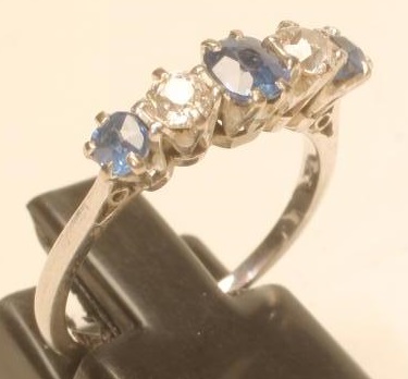 A SAPPHIRE AND DIAMOND FIVE STONE RING Image