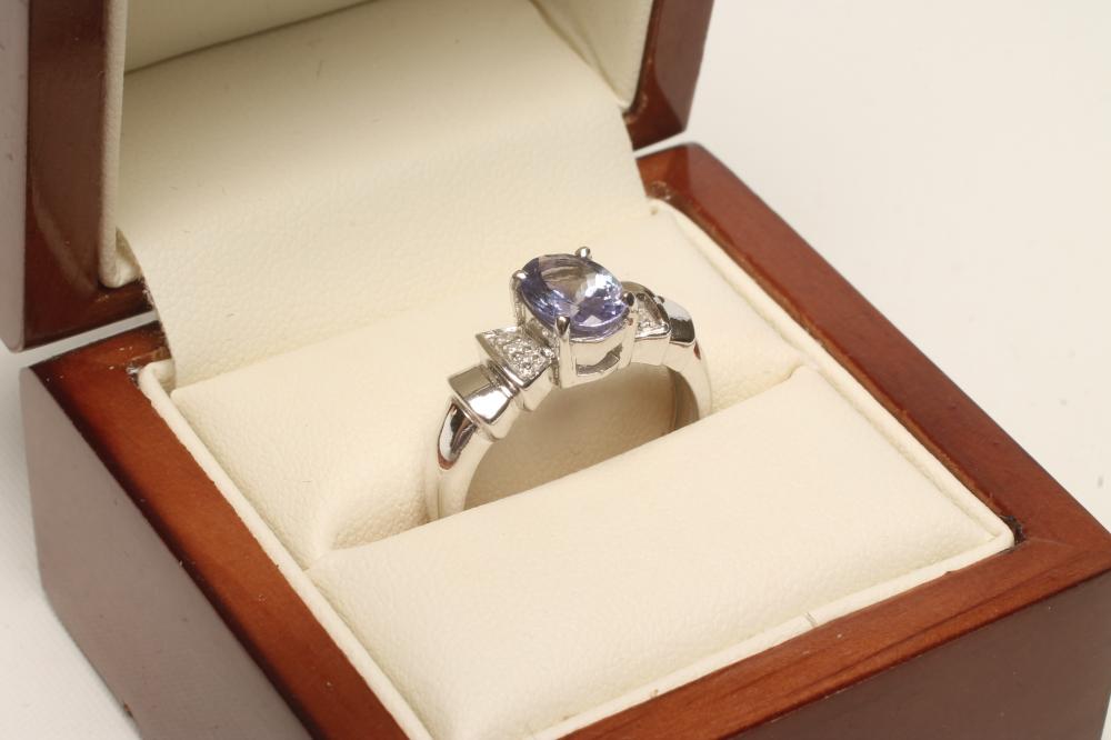 A TANZANITE AND DIAMOND RING Image
