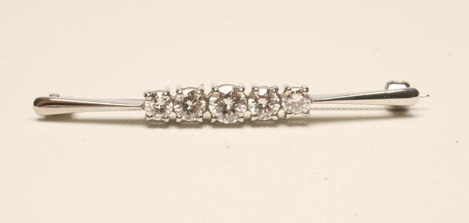 A FIVE STONE DIAMOND BROOCH Image