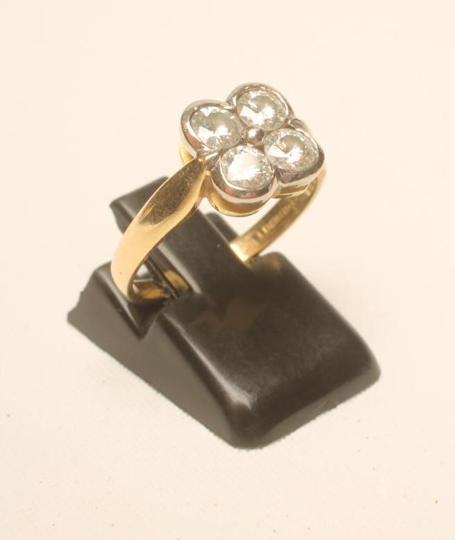 A FOUR STONE DIAMOND RING Image