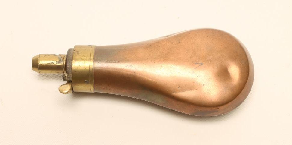 A PISTOL POWDER FLASK by Sykes Image