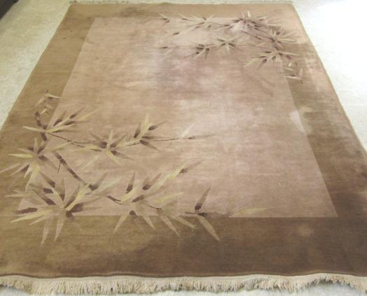 A CHINESE WASHED AND FRINGED CARPET Image