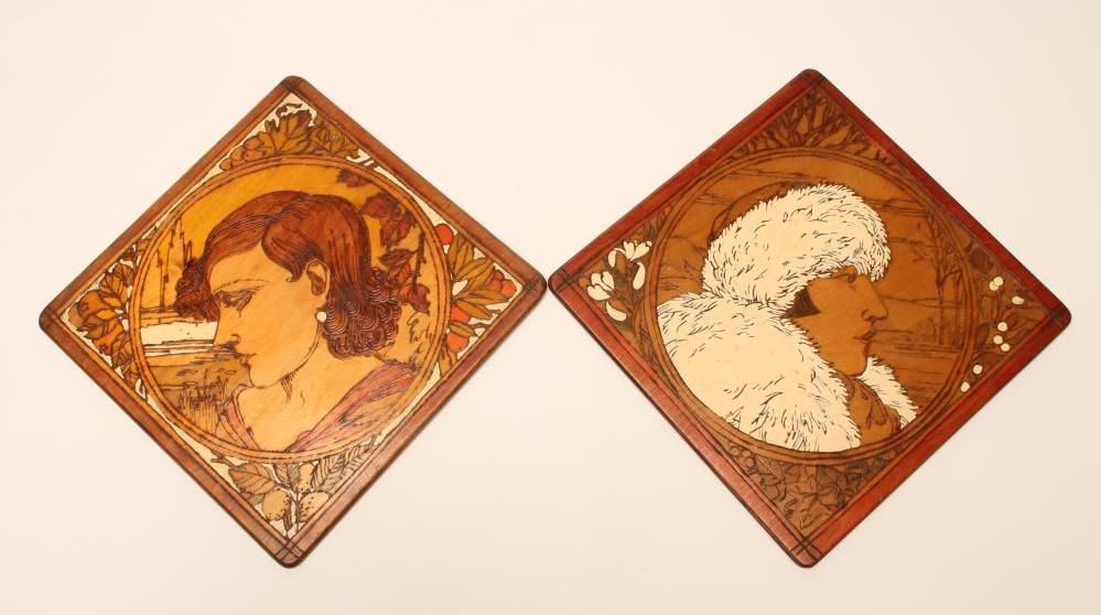 A PAIR OF ART DECO PAINTED POKERWORK SQUARE PLAQUES Image