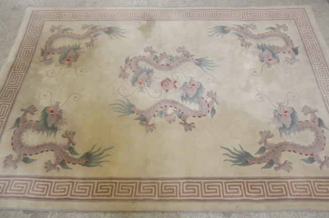 A CHINESE WASHED AND FRINGED RUG Image