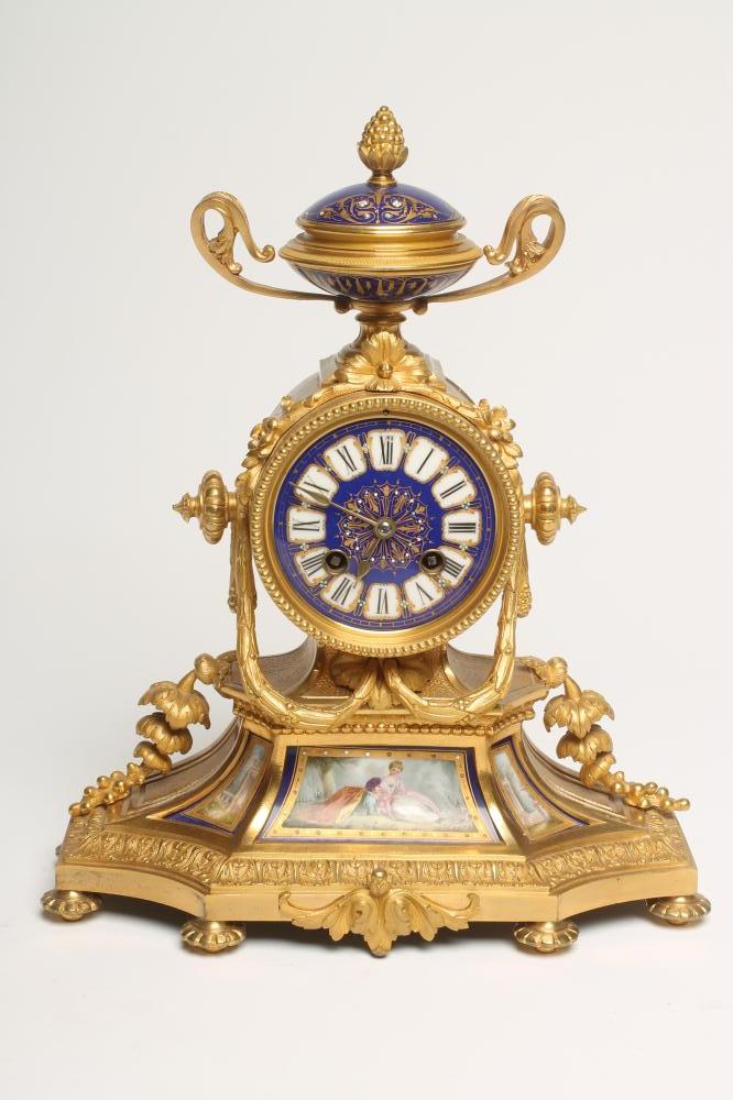 A FRENCH ORMOLU AND PORCELAIN CASED MANTEL CLOCK Image