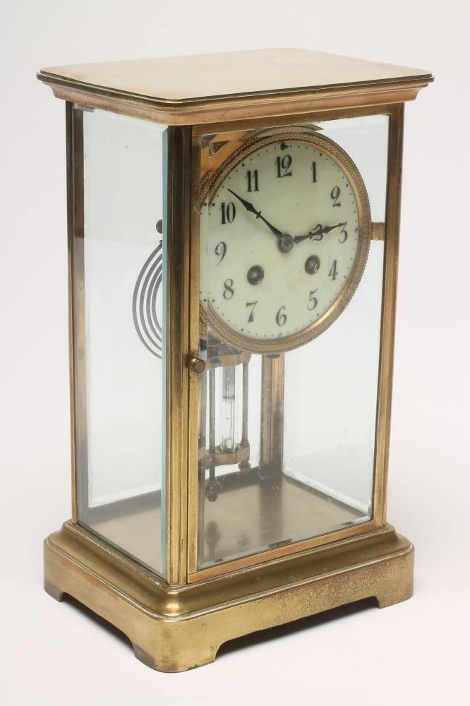 A FRENCH BRASS CASED FOUR GLASS MANTEL CLOCK Image
