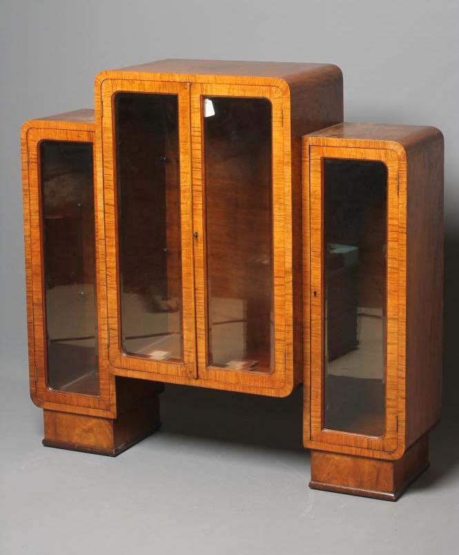 AN ART DECO BURR WALNUT CABINET of rounded oblong form Image