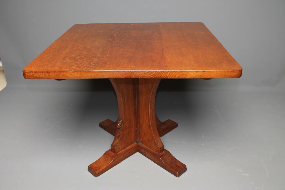 AN ADZED OAK DINING TABLE by Robert Thompson Image