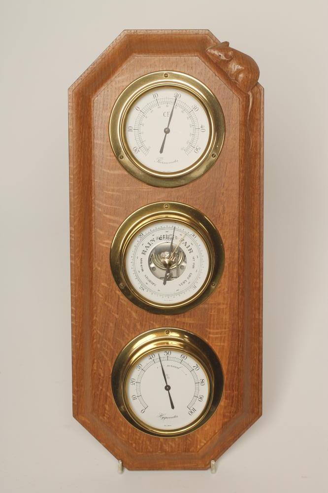 AN OAK WALL WEATHER STATION by Robert Thompson of canted oblong form mounted with a thermometer Image