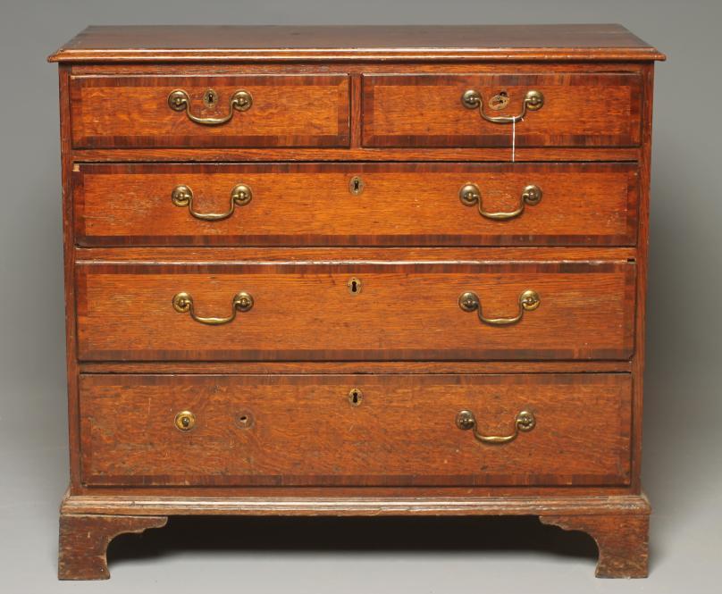 A GEORGIAN OAK AND MAHOGANY BANDED CHEST Image