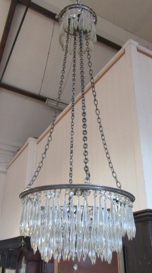 A GILT METAL AND DROP LUSTRE CHANDELIER of graduated tiered circular form Image