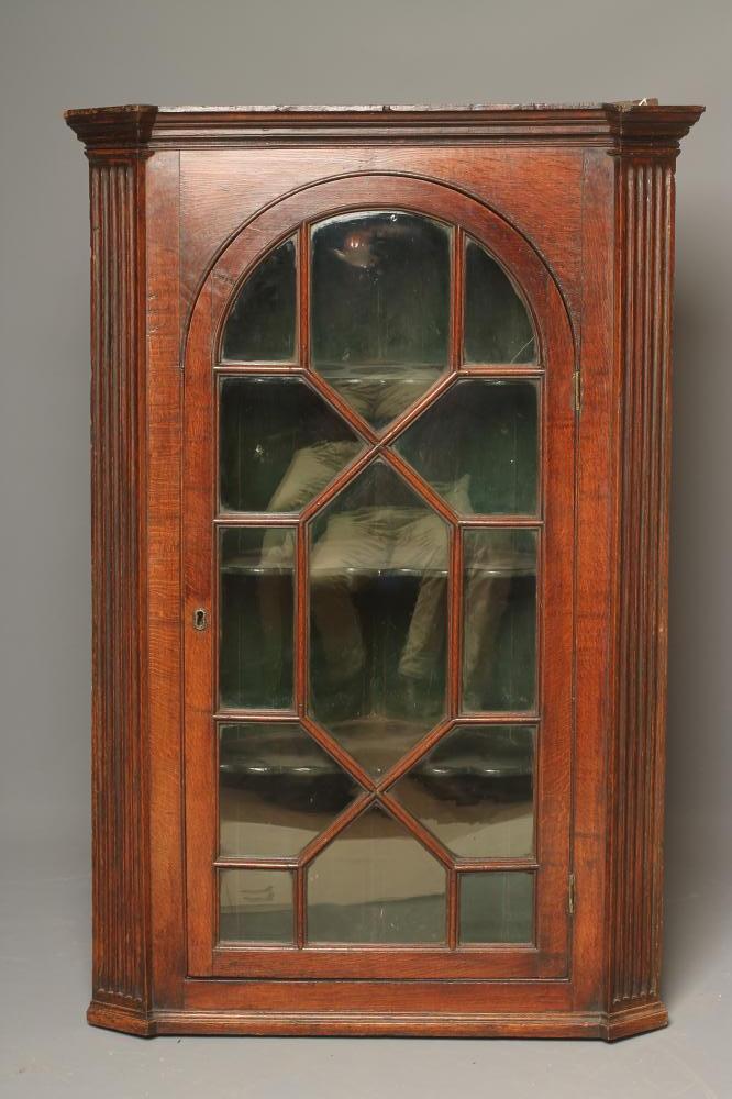 A GEORGIAN OAK CORNER CUPBOARD Image
