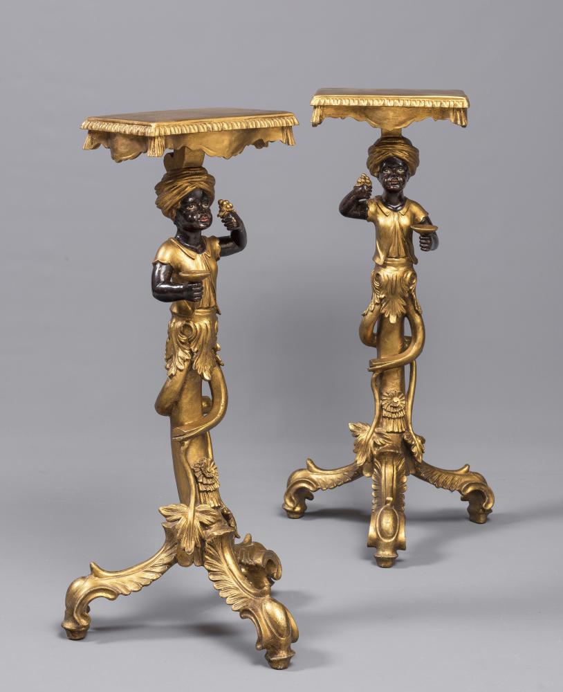 A PAIR OF CARVED PAINTED AND PARCEL GILT BLACKAMOOR TORCHERES Image