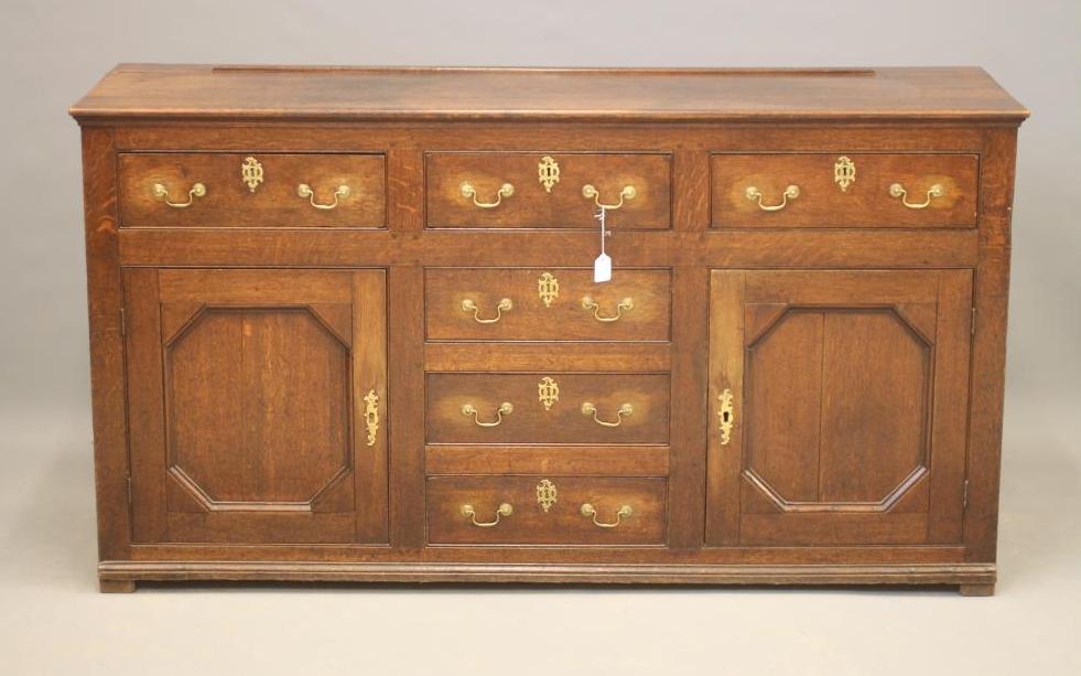 A GEORGIAN OAK ENCLOSED DRESSER Image