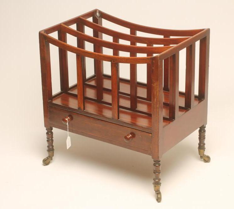 A GEORGE III MAHOGANY CANTERBURY of dished oblong form with three divisions on flat supports Image