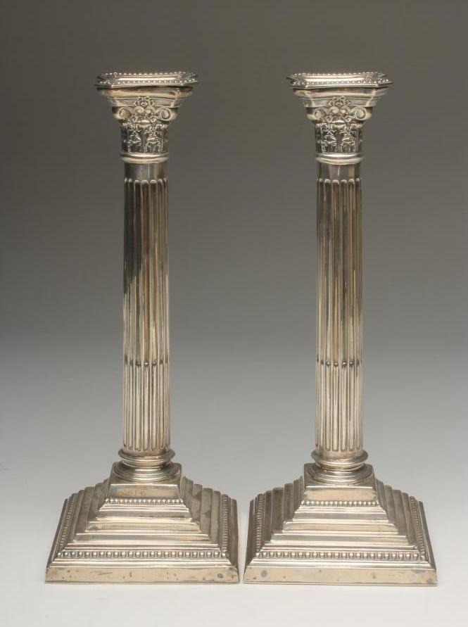 A PAIR OF SILVER CANDLESTICKS Image