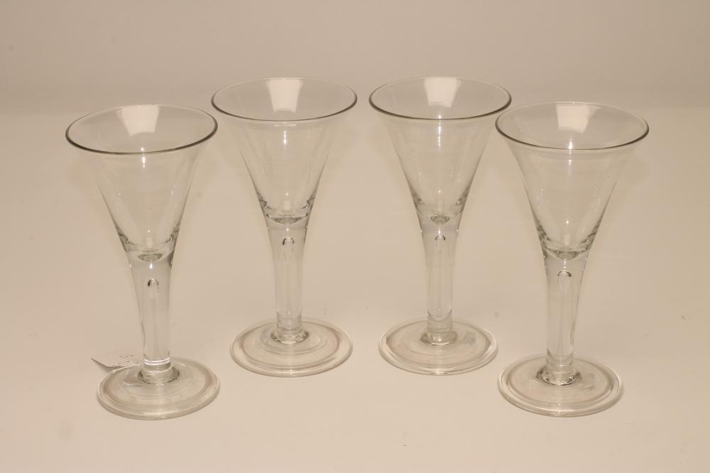 A SET OF FOUR WINE GLASSES Image