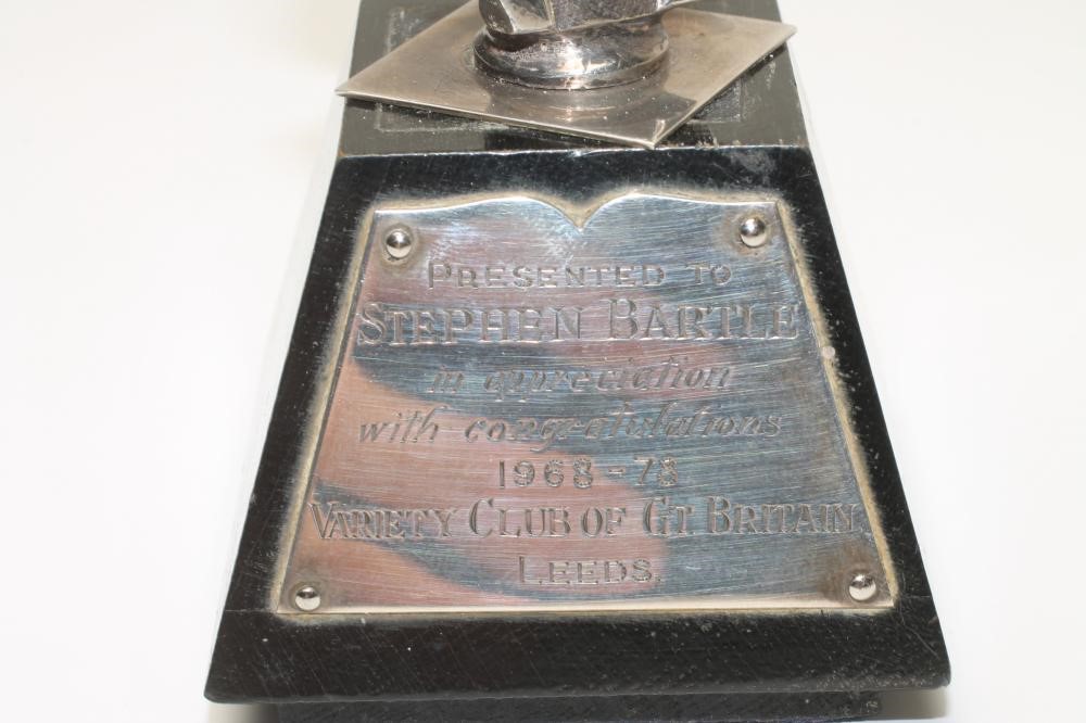 A SILVER HEAD AND SHOULDERS MODEL Image