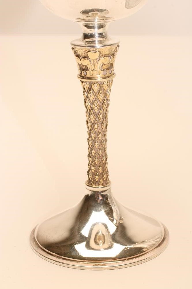 A CLARET JUG AND A PAIR OF MATCHING SILVER GOBLETS Image