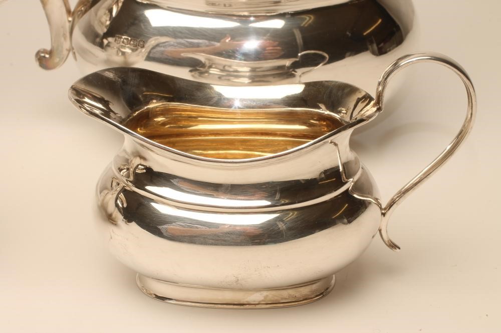 A COMPOSITE THREE PIECE SILVER TEA SERVICE Image