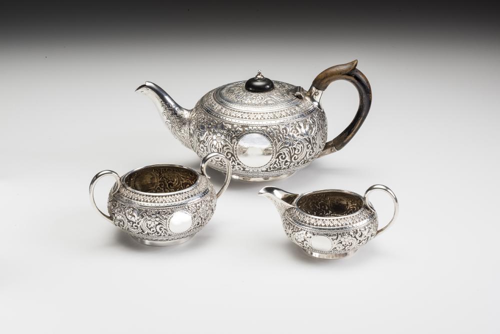 A BACHELOR'S LATE VICTORIAN THREE PIECE SILVER TEA SERVICE Image