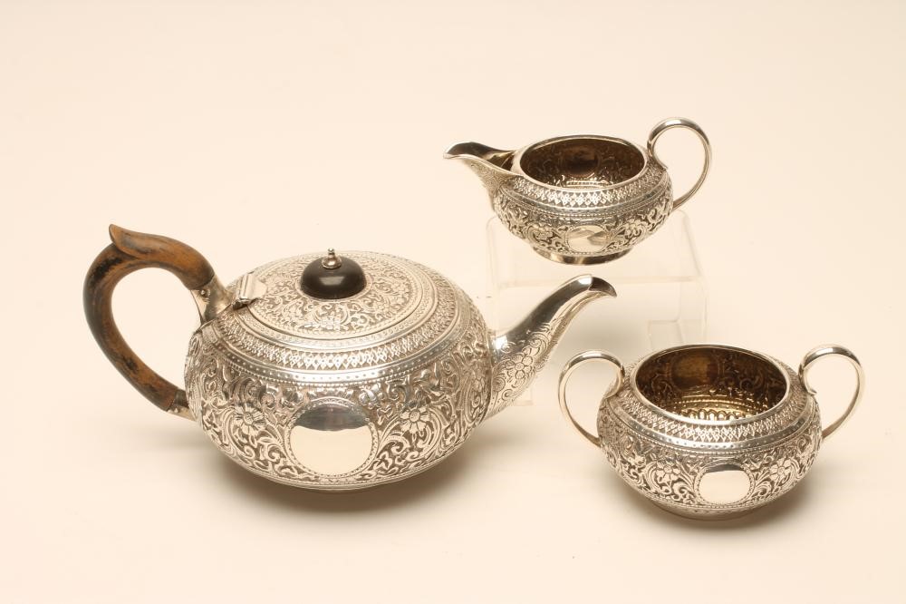 A BACHELOR'S LATE VICTORIAN THREE PIECE SILVER TEA SERVICE Image