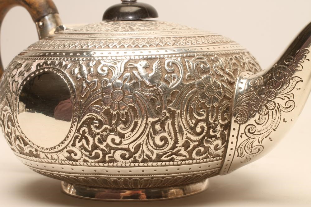 A BACHELOR'S LATE VICTORIAN THREE PIECE SILVER TEA SERVICE Image