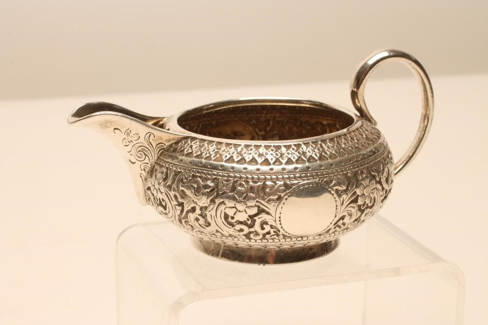 A BACHELOR'S LATE VICTORIAN THREE PIECE SILVER TEA SERVICE Image