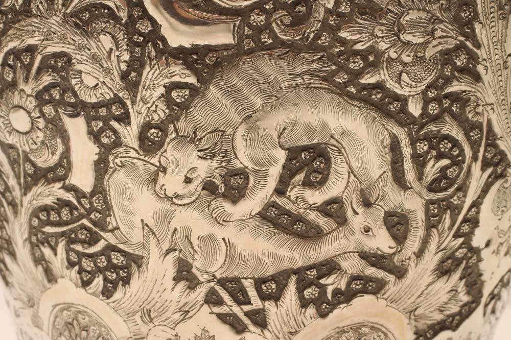 A CHINESE SILVER VASE of flared rounded cylindrical form with sloping shoulders Image