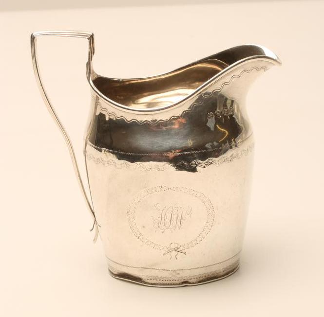 A LATE GEORGE III SILVER MILK JUG Image